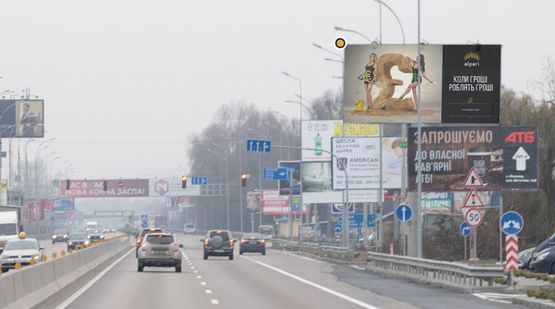 Фото рекламної площини за адресою Днепровское шоссе, из Киева в сторону Обухова, за выездом с парковки м-на"ФОРА", перед поворотом на Лесники