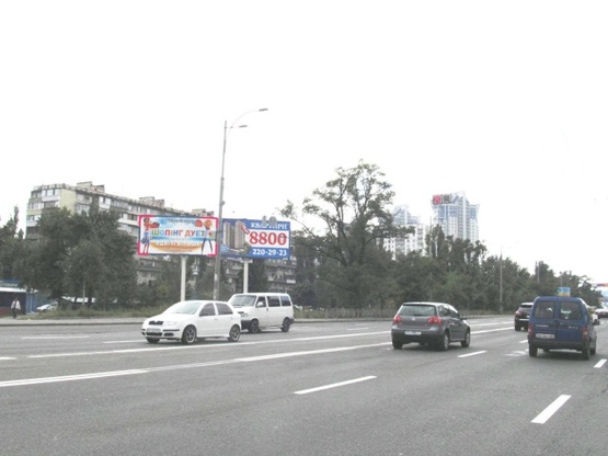 Фото рекламної площини за адресою Воссоединения просп. (ул. Серафимовича, 9), вещевой рынок, маг. "Мобидик"