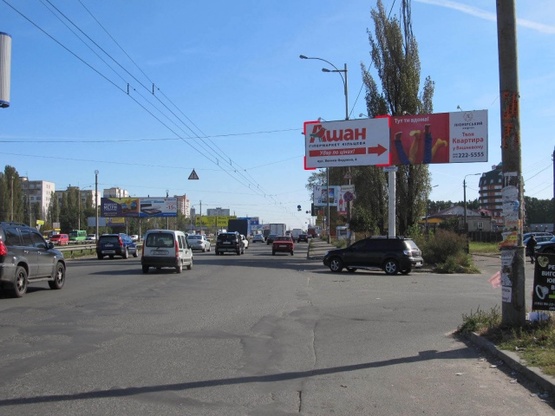 Фото рекламної площини за адресою Кольцевая дорога - поворот к ТЦ "АШАН" (магазин "Технополис", в направлении Софиевской Борщаговки)