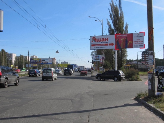 Фото рекламної площини за адресою Кольцевая дорога - поворот к ТЦ "АШАН" (магазин "Технополис", в направлении Софиевской Борщаговки)