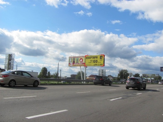 Фото рекламной плоскости по адресу Кольцевая дорога в районе ул. Зодчих, 30, (на разделительной полосе, АЗС "Shell"), по направлению Победы просп.