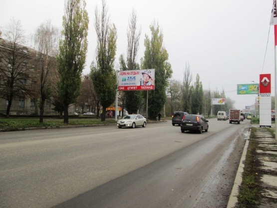 Фото рекламной плоскости по адресу Клочковская ул. - Тобольская ул., (Автомойка "Кузовной центр", “АК АВТО-ЛАКЦЕНТР”, Школьный Сад), направл. в город