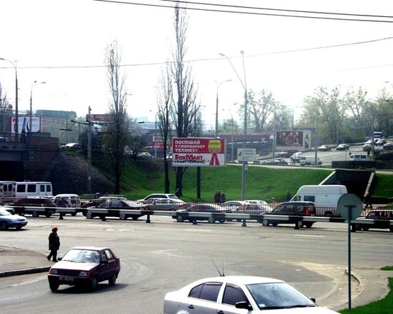 Фото рекламної площини за адресою Пр.Победы,9а/Возд.мост (со стор. Дворца бракосочет)-призма пл.1