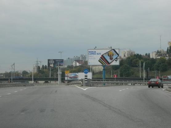 Фото рекламной плоскости по адресу Промислова вул, з'їзд на Наддніпрянське шосе, ст.м.Видубичі, напр. у центр, ст.А1 призма Фото рекламной плоскости по адресу Промислова вул, з'їзд на Наддніпрянське шосе, ст.м.Видубичі, напр. у центр, ст.А1 призма