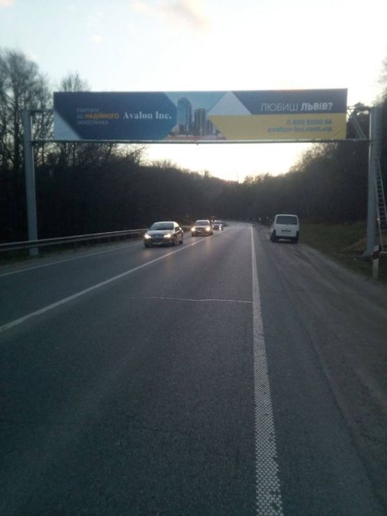 Фото рекламної площини за адресою Трасса М-06 Киев-Чоп, поворот на базу отдыха "Львовская Швейцария", выезд из города Фото рекламної площини за адресою Трасса М-06 Киев-Чоп, поворот на базу отдыха "Львовская Швейцария", выезд из города