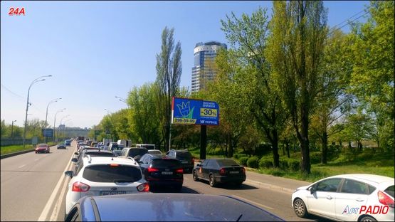 Фото рекламной плоскости по адресу Броварской пр., между МВЦ и АЗС "WOG", в центр