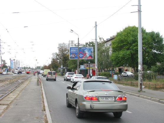 Фото рекламной плоскости по адресу Миропільська вул., 37 поруч будівельний ринок Юність