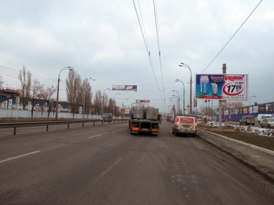 Фото рекламной плоскости по адресу Луговая 12, возле ТРЦ Караван Фото рекламной плоскости по адресу Луговая 12, возле ТРЦ Караван