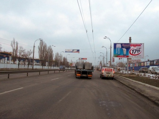Фото рекламной плоскости по адресу Луговая 12, возле ТРЦ Караван Фото рекламной плоскости по адресу Луговая 12, возле ТРЦ Караван