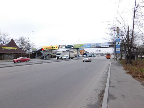 Фото рекламной плоскости по адресу Городская ул., пешеходный мост около ул. Синеозерной