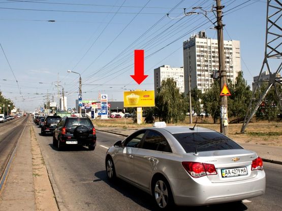 Фото рекламной плоскости по адресу Гагарина пр., 21-А, возле АЗС "ТНК", супермаркета "Новус", ресторана "КФС", в сторону ст. м. "Черниговской"