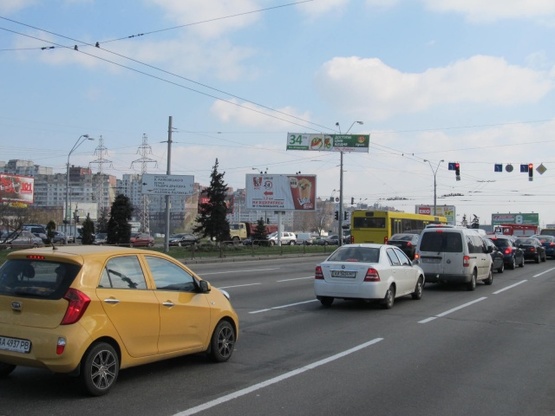 Фото рекламної площини за адресою Ватутина Ген. просп., 22 - бул. Перова (на разделителе), АЗС "WOG", Moto GP салон, в направ. ул. Братиславской