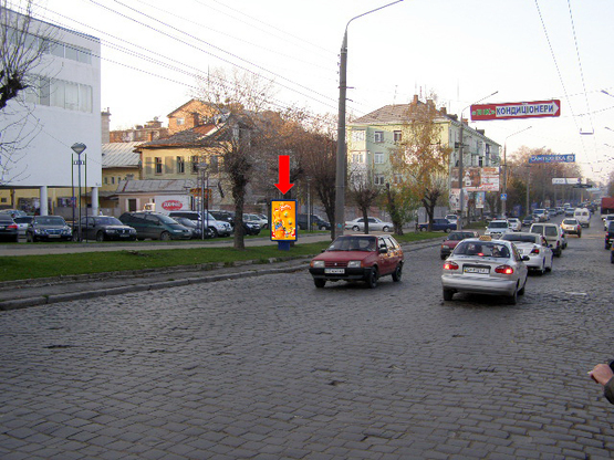 Фото рекламной плоскости по адресу Главная ул., 124 / Гончарова ул., возле фабрики "Импульс", в центр