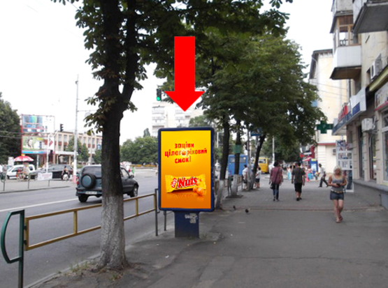 Фото рекламної площини за адресою Киевская ул., 62 / ул. Хлебная, возле магазина "Житомирские ласощи", на светофоре