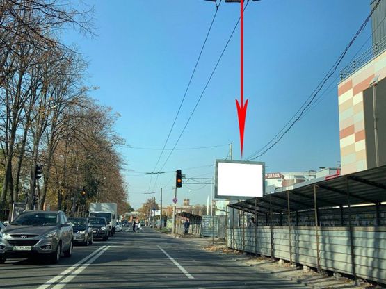 Фото рекламної площини за адресою s059A2,вул. Титова, 32А, біля ТЦ АПОЛЛО, рух у бік вул. Макарова, на світлофорі