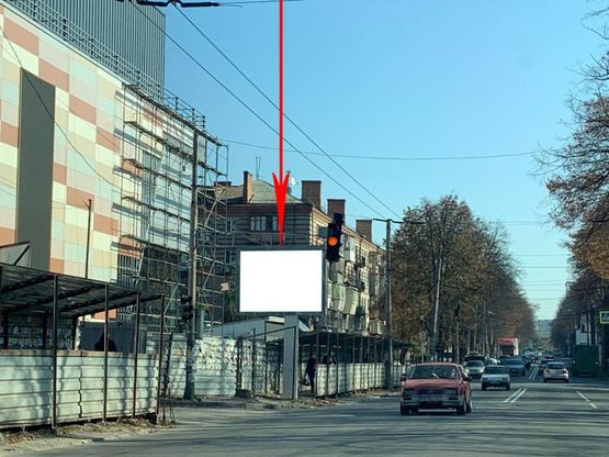 Фото рекламной плоскости по адресу s059B1,вул. Титова, 32А, біля ТЦ АПОЛЛО, рух у бік просп. О.Поля, на світлофорі