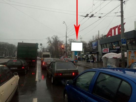 Фото рекламной плоскости по адресу t066A2,просп. Олександра Поля - просп. Пушкіна, біля "АТБ", біля світлофора Фото рекламной плоскости по адресу t066A2,просп. Олександра Поля - просп. Пушкіна, біля "АТБ", біля світлофора