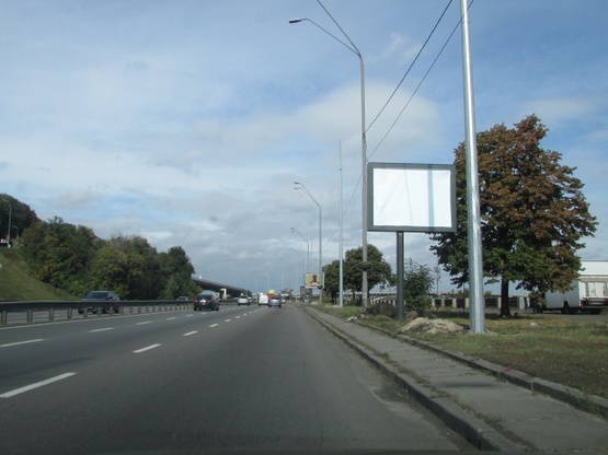 Фото рекламної площини за адресою Набережне шосе (після 500 метрів від Наводницького парку) по ходу до мосту Метро