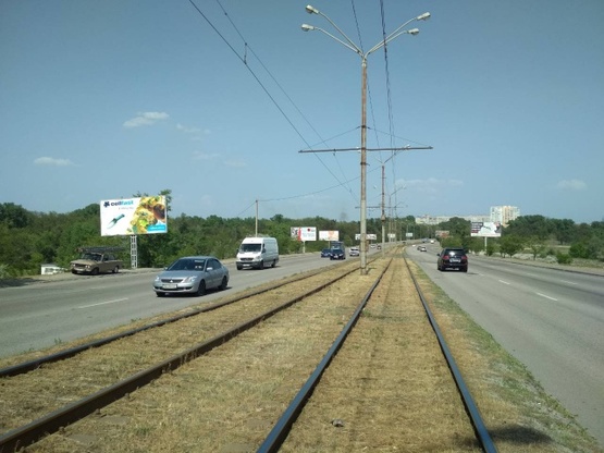 Фото рекламної площини за адресою Донецкое шоссе - Кайдакский мост (сьезд с моста), в сторону ул. Передовой