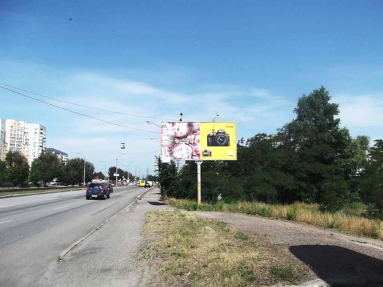 Фото рекламной плоскости по адресу Донецкое шоссе (30 м. от канала, АЗС "ТНК", АЗС "Юкон", ресторан "Робин Гуд"), в направл. ул. Передовой