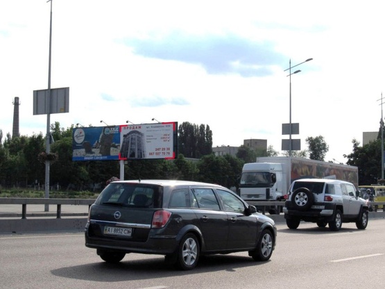 Фото рекламной плоскости по адресу Бажана Н. просп. - Харьковская пл., (АЗС "УкрАВТО",Авто сервис АТЛ), въезд в Киев, (правый)