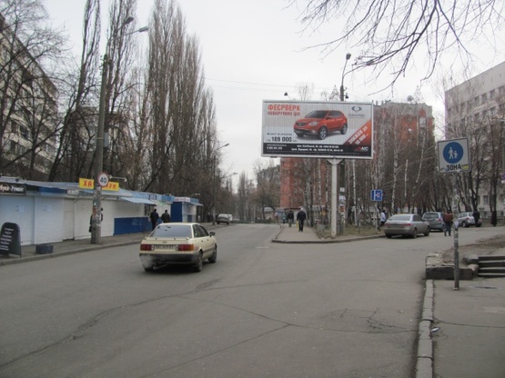 Фото рекламної площини за адресою Политехнический пер. , 25/29, (100м.к ст. м. Политехнический ин-т, парк КПИ, НИИ таможенного дела), в направ. Ул. Борщаговской, призма