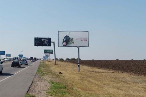 Фото рекламної площини за адресою Овидиопольская дорога - напротив промрынка "7км", от "Эпицентра" к ЖК "7-е Небо" Фото рекламної площини за адресою Овидиопольская дорога - напротив промрынка "7км", от "Эпицентра" к ЖК "7-е Небо"