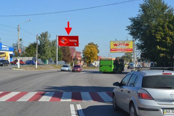 Фото рекламной плоскости по адресу Полтавский шлях-пос.Песочин-пер Шевченко- возле маркета АТБ,в центр