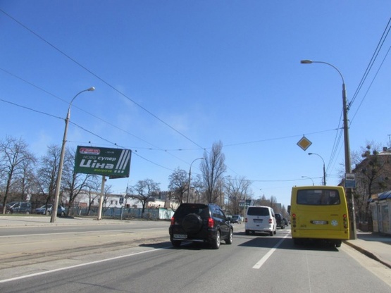 Фото рекламной плоскости по адресу Пражская ул., 5 (БЦ "Прага", магазин "Продукты", ЗОШ  №126), направ. из центра города Фото рекламной плоскости по адресу Пражская ул., 5 (БЦ "Прага", магазин "Продукты", ЗОШ  №126), направ. из центра города