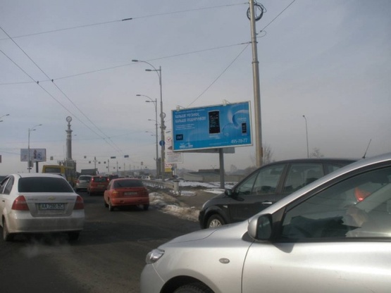 Фото рекламної площини за адресою Воссоединения проспект / Русановская Набереж.