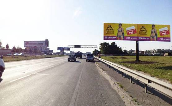 Фото рекламной плоскости по адресу Окружная 12/ Лерой Мерлин,супермаркет Новус (А) левый (напр.к пр-ту Победы)