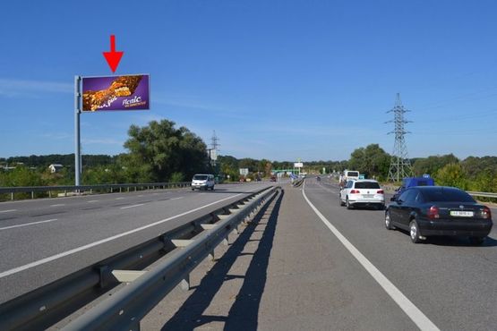 Фото рекламной плоскости по адресу Эстакада-пос.Песочин-выезд из города в ст.трассы Киев-Харьков-Довжанский