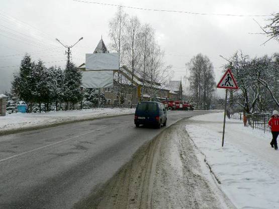 Фото рекламной плоскости по адресу Траса Н-09 Мукачево-Львів, Свободи, центральна частина міста, пожежна частина, масив багатоповерхових будівель, напрямок руху на Буковель (низ)