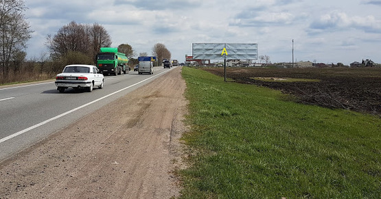 Фото рекламной плоскости по адресу Обїздна М-06, Київ-Чоп, біля Лео Кераміка в сторону Пасіки-Зубрицькі