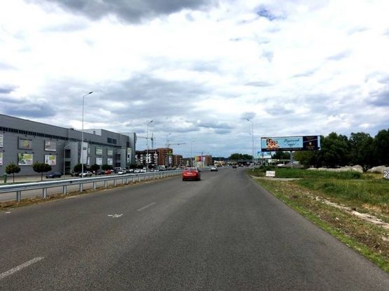 Фото рекламной плоскости по адресу Дніпровське шосе, поворот на с. Ходосеевка, напротив ТРЦ "Мегамаркет в Ходосіївці", "Киев-Обухов", км 23+850 лево