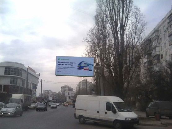 Фото рекламной плоскости по адресу Вильямса ул., 62/1 - 100 м. до Королева ул. (возле ТЦ "Таировский") Фото рекламной плоскости по адресу Вильямса ул., 62/1 - 100 м. до Королева ул. (возле ТЦ "Таировский")