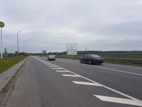 Фото рекламной плоскости по адресу Обїздна М-06, Київ-Чоп, перед с.Гамаліївка АЗС WOG в сторону Львова (нижній)