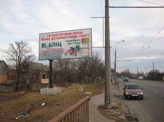 Фото рекламной плоскости по адресу П-т К. Володимира, міст через р.Протока (з центру)