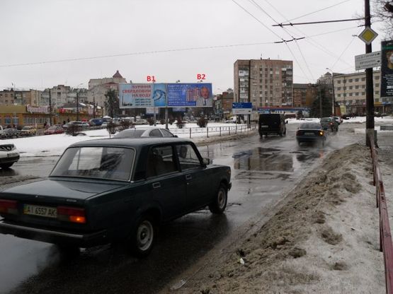Фото рекламной плоскости по адресу Пл. Петра Запорожца (призматрон) напрямок з  центру