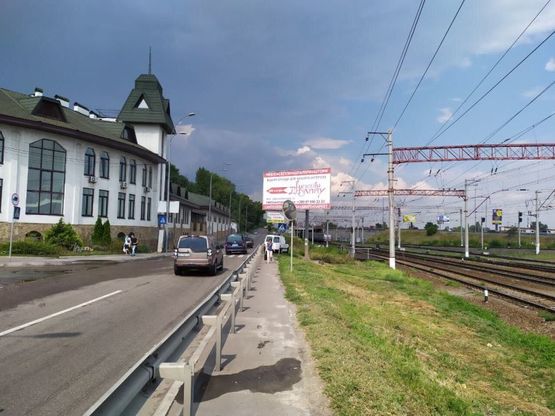 Фото рекламної площини за адресою Залізничне шосе/вул. Тимірязєвська перехрестя, в напрямку Столичного шосе