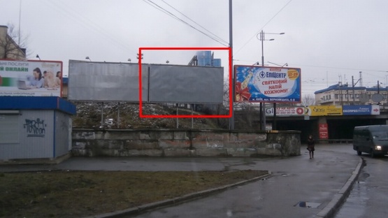 Фото рекламной плоскости по адресу Василия Липковского ул. (Урицкого) /  Николая Осровского ул. (Максима Кривоноса площадь), возле ж/д моста (правый)