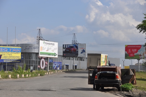 Фото рекламной плоскости по адресу вул. Дніпросталевська - авторинок (в'їзд з вул. О. Оцупа)