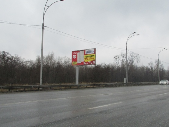 Фото рекламной плоскости по адресу Академіка Заболотного, (за 300 метрів руху до росподілювача в напрямку до Одеськой площі)