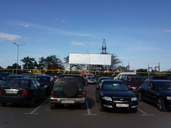 Фото рекламної площини за адресою Ривьера ТРЦ, автостоянка  А левая Фото рекламної площини за адресою Ривьера ТРЦ, автостоянка  А левая