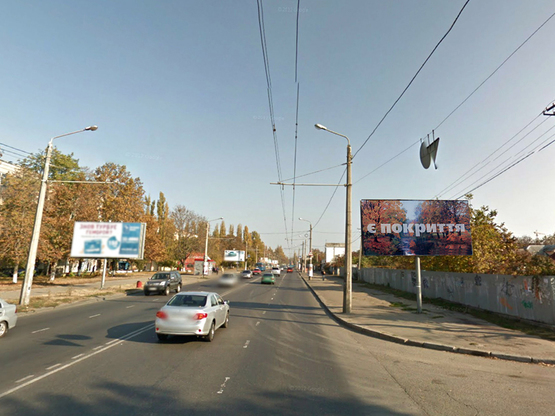 Фото рекламной плоскости по адресу Комарова - завод "Промсвязь"