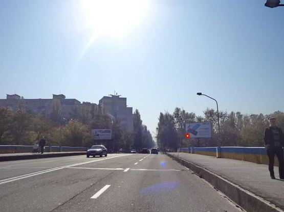 Фото рекламной плоскости по адресу Раисы Окипнoй ул., мoст через Русанoвский канал