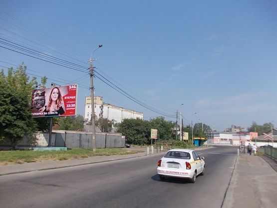 Фото рекламной плоскости по адресу Белая ул., 50 м. к Старицкого ул. из центра.