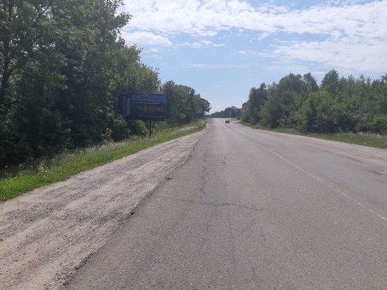 Фото рекламной плоскости по адресу м. Хотин, вул. Т. Шевченка (біля в*їздного знака м. Хотин)