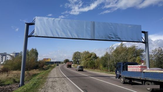 Фото рекламной плоскости по адресу Кольцевая дорога, Западный обход, с. Скнилов, возле "Trans-Service-1", в сторону ТЦ "Metro"