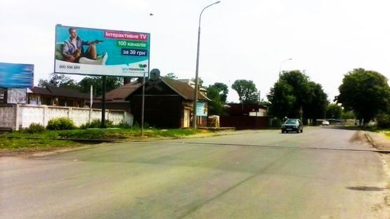 Фото рекламной плоскости по адресу Карпенко-Карого ул., (ж/д переезд)